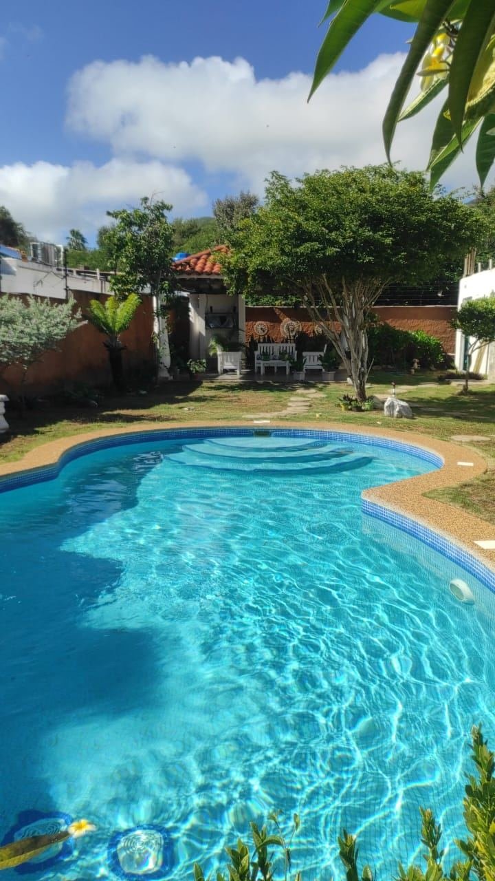 Jardín y piscina - Posada Villa Taormina